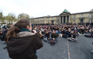 A speaking of a young woman in front of the general assembly of the #NuitDebout in Bordeaux, Place de la Republique. / AFP PHOTO / MEHDI FEDOUACH - AFP