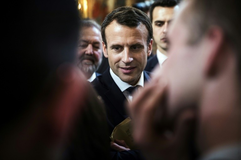 French President Emmanuel Macron talks with farmers at the Elysee Palace on 22 February 2018.