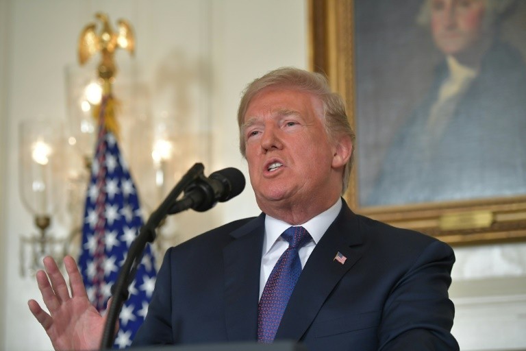 President Donald Trump addresses the nation to announce an ongoing military operation in Syria on April 13, 2018 in Washington. 