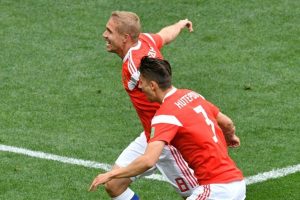 Russian midfielder Yuri Gazinskiy (l) has just scored the first goal of the Russian World Cup on June 14, 2018 in Moscow.