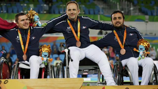 The French fencers at the Paralympic Games, Tokatlian Damien, Jack and Maxime Ludovic Lemoine on the podium with their bronze team medal.