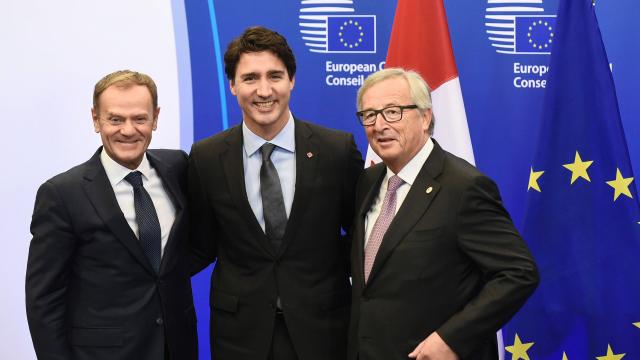 Donald Tusk, President of the European Council, Canadian Prime Minister Justin Trudeau and President of the European Commission, Jean-Claude Juncker sign CETA free trade agreement