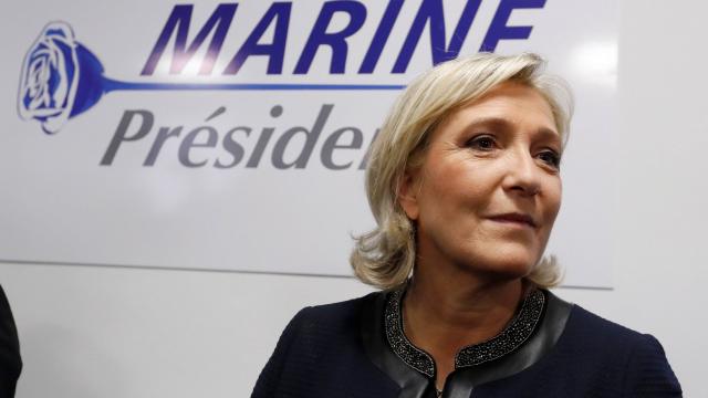 Marine Le Pen displays her campaign logo for the French presidential campaign