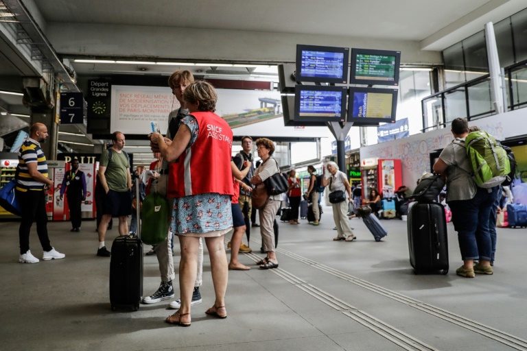 Assistance to travelers at Montparnasse station in Paris, July 30, 2018.
