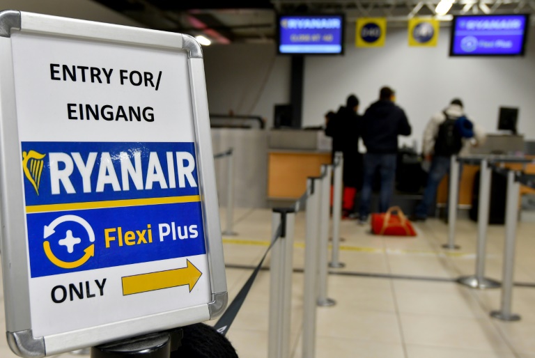 Passengers at the counter of the Irish low-cost airline Ryanair at Berlin-Schoenefeld airport on 22 December 2017.