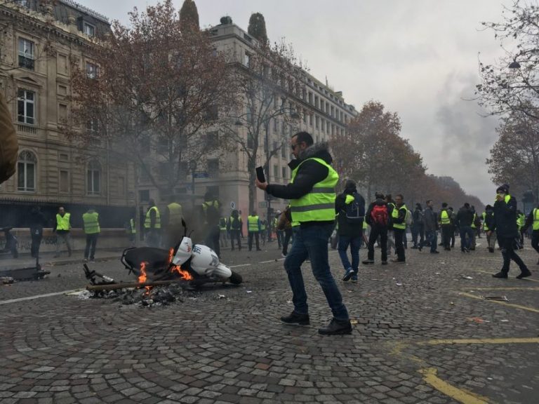 Protesters set fire to everything they find, here a scooter.