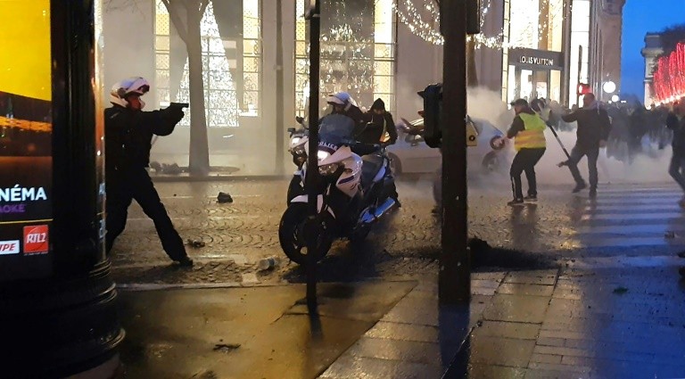 Video capture of a policeman filmed on December 22, 2018 on the Champs-Elysees in Paris.