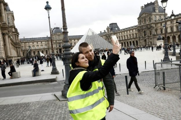 "Yellow Vests" in front of the Louvre Pyramid in Paris, December 2, 2018. 