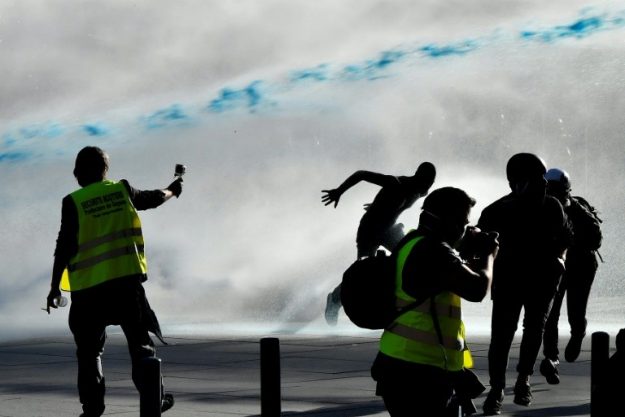 Police use water cannons to disperse a demonstration of "yellow vests" on March 23, 2019 in Bordeaux. 