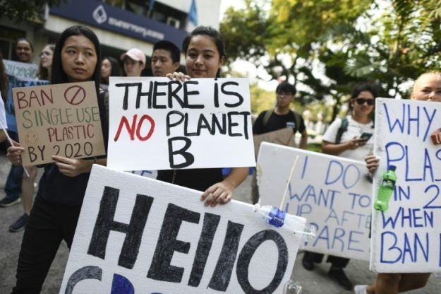 Protesters raise awareness on climate change on March 15, 2019 in Bangkok.
