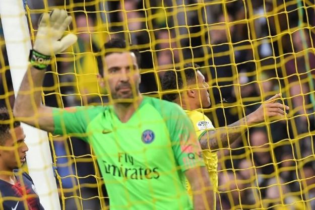 PSG goalkeeper Gianluigi Buffon has just conceded a goal from Nantes' Diego Carlos (d) on 17 April 2019 in Nantes.