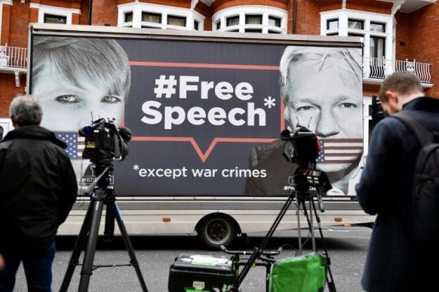 A poster plastered on a truck in support of WikiLeaks founder Julian Assange in front of the Ecuadorian Embassy where he is then a refugee, in London on April 5, 2019.