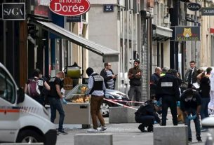 Investigators at the scene of the parcel bomb attack that left 13 people injured in Lyon, May 25th