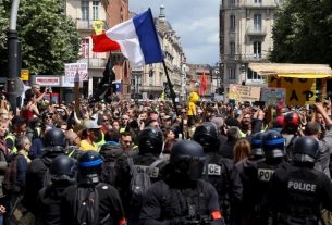 Protesters face the police during the act 26 yellow vests, in the streets of Toulouse, Saturday, May 11, 2019