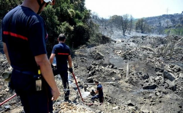 Firefighters intervene after a wild fire in the Gard, Saint-Gilles on June 29, 2019. 