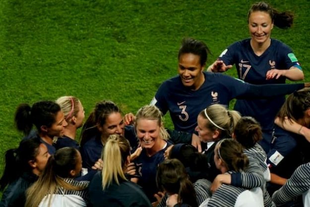 Midfield Amandine Henry (c) congratulated by her team-mates after her goal against South Korea, in the opening match of the World Cup at the Parc des Princes, on June 7, 2019. 