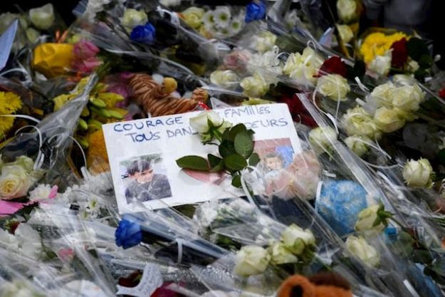 Flowers are laid in tribute to the ten-year-old boy and his seven-year-old cousin. 