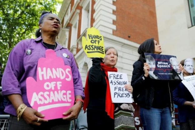 Supporters of WikiLeaks founder Julian Assange protest in London on May 30, 2019. 