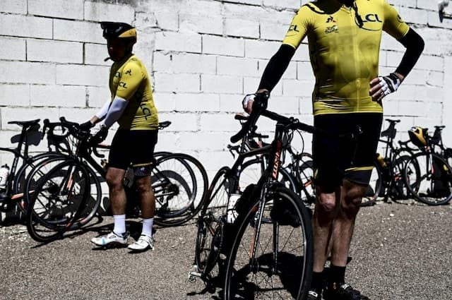 Amateur cyclists wearing the yellow jersey of the Tour de France 2019 with the effigy of former riders wearing the prestigious tunic in the Grande Boucle, on May 14, 2019 in Romilly-sur-Seine. 