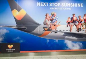 A poster of tour operator Thomas Cook at Gatwick Airport in London