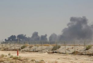After a drone attack, smoke rises above the Saudi Arabian giant Aramco's Abqaiq oilfield, 60 km southwest of Dahran, eastern Saudi Arabia, on September 14, 2019