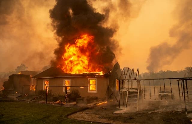 Violent fires, thousands of evacuees in California