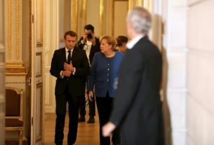 President Emmanuel Macron and German Chancellor Angela Merkel at the Elysee Palace, October 13, 2019 (© POOL / AFP / Ludovic Marin, President Emmanuel Macron and German Chancellor Angela Merkel