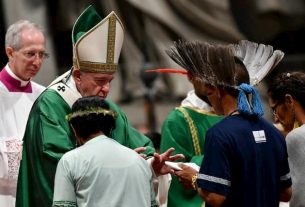 Pope Francis greets representatives of the indigenous peoples of Amazonia during a homily at St. Peter's Basilica in the Vatican on October 6, 2019.