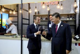French President Emmanuel Macron and his Chinese counterpart Xi Jinping visit the French pavilion at the International Import Fair in Shanghai on November 5, 2019