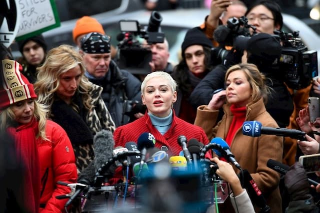 Actress Rose McGowan (center), who was one of the first to publicly accuse Harvey Weinstein of rape, speaks, surrounded by other accusers of the film producer at the start of his trial in Manhattan, January 6, 2020 . 