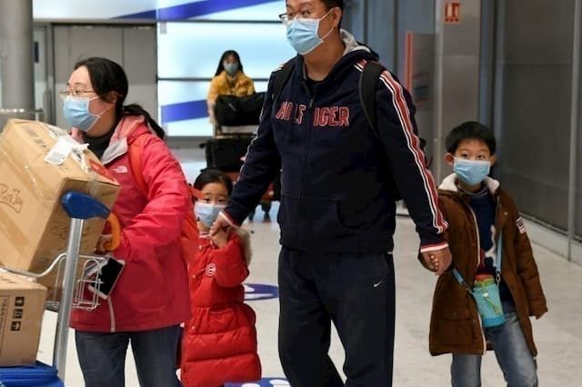 A family arrived from China, at Charles-de-Gaulle airport near Paris, on January 26, 2020.