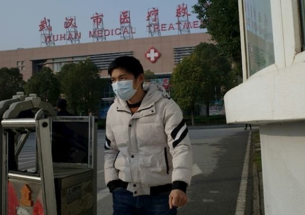 A man leaves a hospital in Wuhan, China on January 12, 2020, where an epidemic caused by a mysterious virus has started.