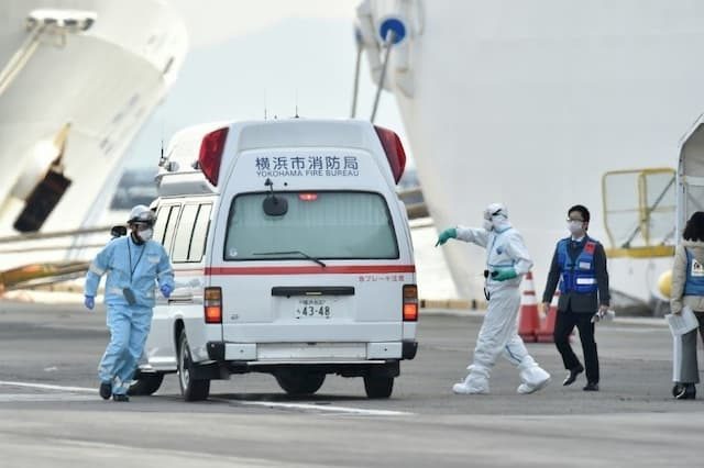 Protective overalls medical teams ready to assist patients infected with the new coronavirus aboard the cruise ship Diamond Princess February 7, 2020 in Yokohama, Japan.