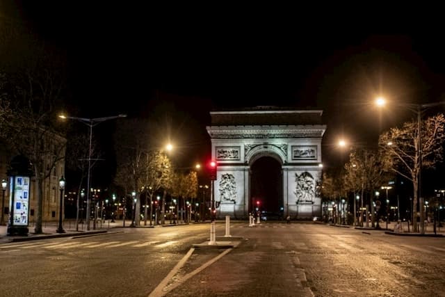 The Arc de Triomphe at the end of the deserted Champs-Elysées, March 26, 2020 in Paris. 