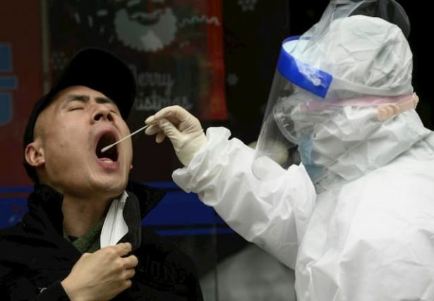 A man was tested for the coronavirus on March 29, 2020 in Wuhan, in the Chinese province of Hubei.