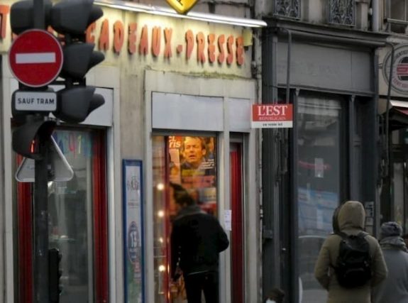 Customers wait outside a tabac shop in downtown Nancy (Meurthe-et-Moselle), during confinement.