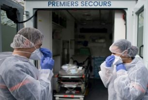 Civil protection carers take charge of a migrant infected with Coronavirus Covid-19, on April 7, 2020 in Saint-Herblain (Loire-Atlantique)