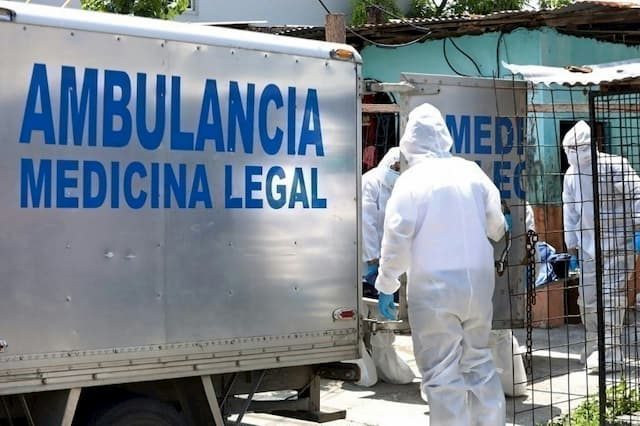 Legal experts recover the body of a Covid-19 victim in Guayaquil, Ecuador, on April 6, 2020.