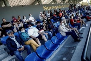 Several hundred spectators, mostly masked, attended the friendly footballmatch between Caen and Paris FC at the Michel d'Ornano stadium on July 11, 2020