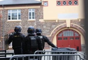 Gendarmes evacuate the Salle de la Cité in Rennes